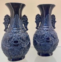 A pair of Chinese Imperial Blue- glazed vases- Qianlong Seal marks of the period. Both depicting