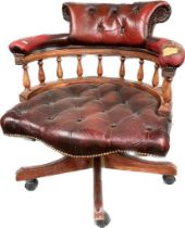 A Chesterfield ox blood captains chair [needs attention]