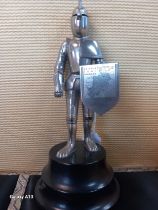 Vintage metal knight figural lighter, stood upon a musical base. [20cm high]