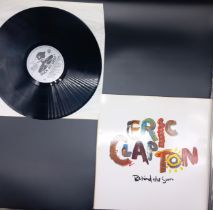 A Collection of 12 Original Eric Clapton LPs To Include, Backtrackin, The Survivor, Slowhand, Live