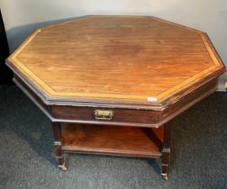 19th century octagonal parlour/ games table; Fitted with four under drawers, raised on four carved