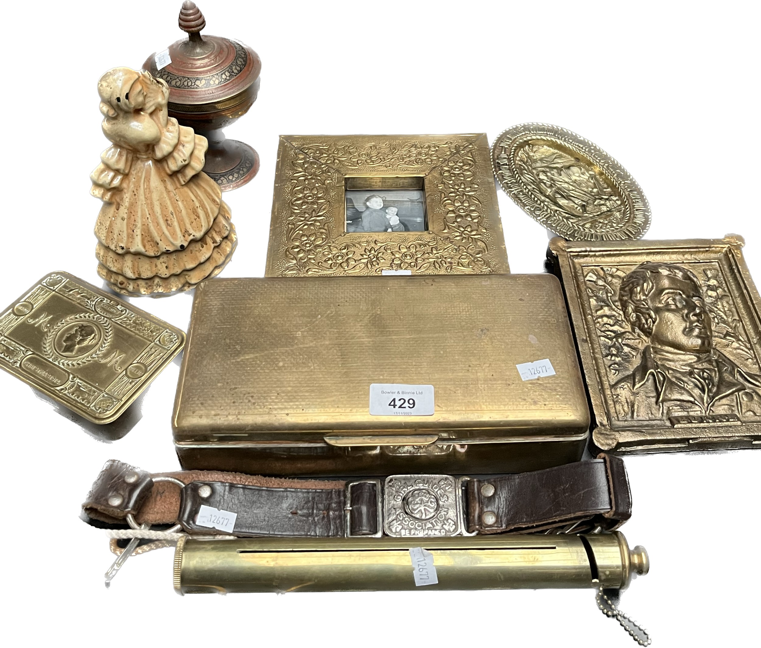 A Selection of brass wares and odds; WWI Christmas tin, Cast iron and enamel crinoline lady fire