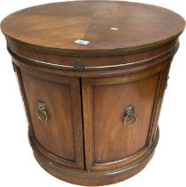 20th century drum side table, the banded circular top above two cupboard doors with opposing dummy