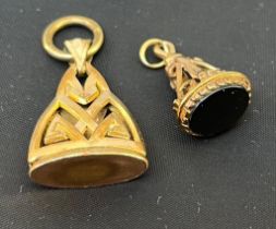 A 9ct gold seal, ornate support to the hardstone matrix, and a gilt metal seal, with Celtic style
