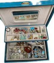 A box of costume jewellery; Various silver jewellery, amber pendant and necklace