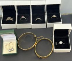 Eight Pandora Rings- six 925 silver and two metal. Two Rolled gold bangles and a pair of silver