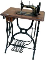 Antique cast iron based singer sewing machine table; fiddle shaped sewing machine. [74x65x42cm]