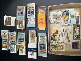 A Selection of mixed vintage cigarette cards; flowers and wildlife. comes with cigarette boxes-