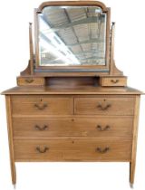 A late 19th century chest of drawers with fitted dressing table mirror top [110x106x49]