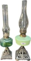 Two antique glass and metal base paraffin lamps. [Tallest- 53cm high]