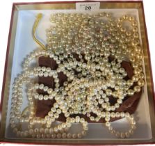 Vintage pearl necklace with various faux pearl necklaces.