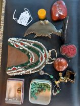 A Collection of odds; turned red agate stone, beaded purse, WHW Austrian bronze/ brass? cow study,