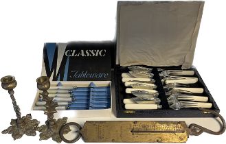 A Selection of odds; Two boxed cutlery sets, Two brass candlesticks and Salter pocket balance