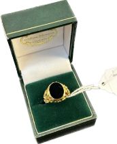 9ct yellow gold signet ring; pierced and textured gold shank. Black onyx. [Ring size K] [4.42Grams]