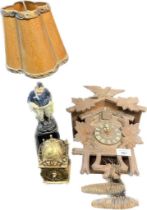 Black Forest Cuckoo clock, Smiths brass bell clock and figural table lamp.
