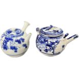 Two Chinese blue and white painted tea pots. [Nibbles/ chips to spouts]