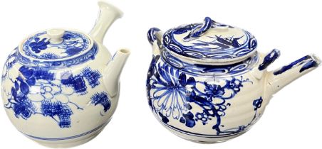 Two Chinese blue and white painted tea pots. [Nibbles/ chips to spouts]