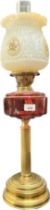 Antique brass and cranberry glass paraffin desk lamp with ornate shade and glass funnel. [Small