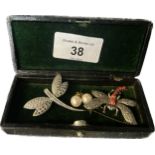 Two vintage dragonfly brooches and a pair of pearl earrings; Silver, marcasite and red stone