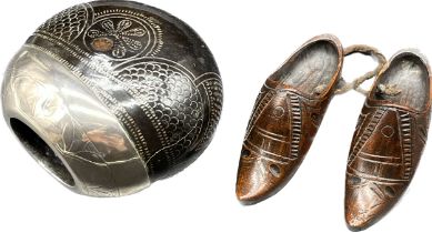 Continental silver mounted nut and a small pair of English carved Treen Shoes. [19th century]