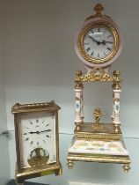 Vintage porcelain floral mantel clock with brass gilt trim and cherub figurine. [33cm high] Along