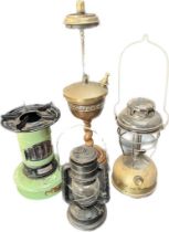 Four various paraffin lamps; Vintage Valor Minor stove, Chalwyn storm lamp, Tilley storm lamp and