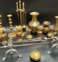 Collection of brass and companion items; Pair of Cast metal fire dogs with utensils, Arabic ornate