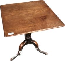 George III Mahogany tea table, the square tilt top on a baluster column and tripod base ending in