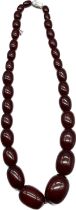 A Graduating cherry amber bead necklace, fitted with a 925 silver clasp and catch. [23cm drop] [52.