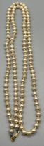 Vintage cultured pearl necklace with gilt metal catch attached. [43cm drop] [84cm length]