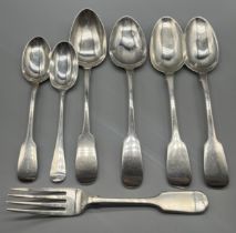 A Selection of Silver hallmarked serving spoons and single fork; Victorian London silver fork,