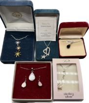 A Lot of five boxed items of silver jewellery; Two Silver Bradford exchange pendants fitted with