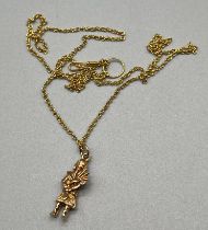 9ct yellow gold piper figure pendant, together with a 14ct yellow gold necklace- [Tested using Kee