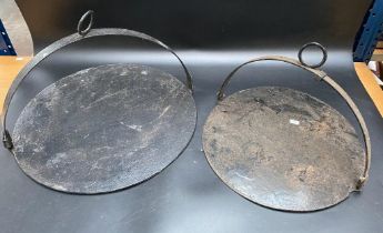 A collection of two antique cast iron cooking skillet's [46cm diameter]