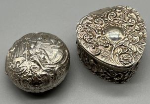 Birmingham silver raised relief heart shaped pill box together with an antique silver raised