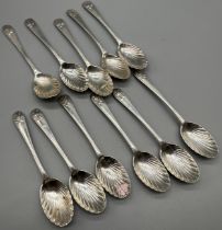 Eleven London silver shell design tea spoons. [109grams]