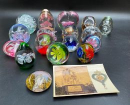 A collection of various paperweights to include Marcaret virgin Martyr of the ocean wave monument