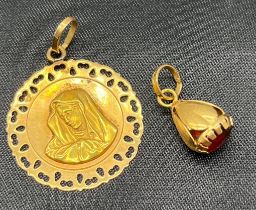18ct yellow gold Virgin Mary pendant, together with an 18ct yellow gold pendant set with a garnet