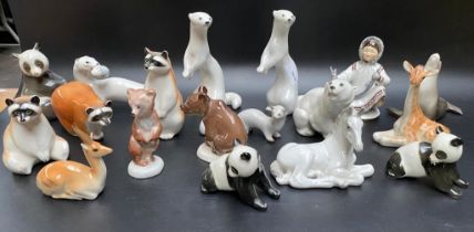 A collection of Russian pottery figures; Racoons, otters & polar bears