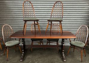 Ercol table with four matching chairs and two carver chairs [73x183x81cm