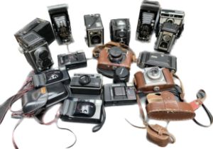 A large collection of vintage cameras; crystar camera, bellows cameras and Kodak made cameras