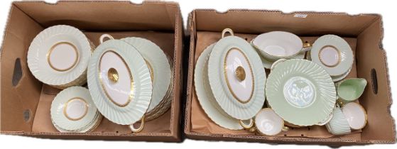 A large Minton's tea/ dinner service, green and white design finished with a gold trim