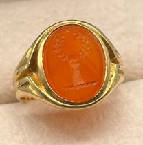 Antique 18ct yellow gold and red agate stone seal ring. Seal- depicts hand holding a wreath. [Ring