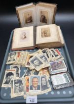 A collection of two Victorian photo albums full of Victorian portraits along with a large collection