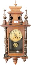 Antique wall clock; Mahogany casing, comes with key and pendulum. [74cm high]