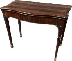George III mahogany serpentine card table, the fold over top opening to a green baize playing