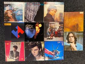 A collection of records; Paul young , James Taylor & pat benatar