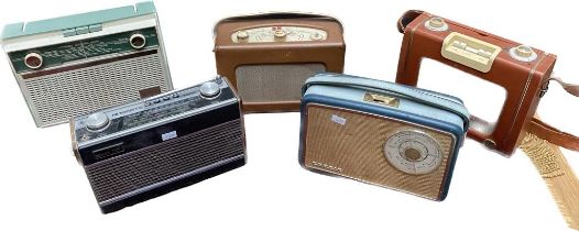 A collection of five vintage radios; Roberts radios and Philips.