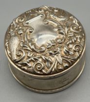 Ornate Birmingham silver round lidded jewel box. Lid depicts birds, flowers and green man face.