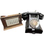 A Vintage Black Bakelite telephone & an antique desk calendar